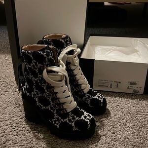 Black and white Gucci logo boots